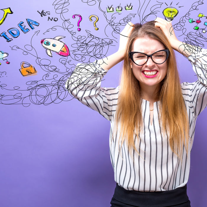 woman with hands on head trying to remember things
