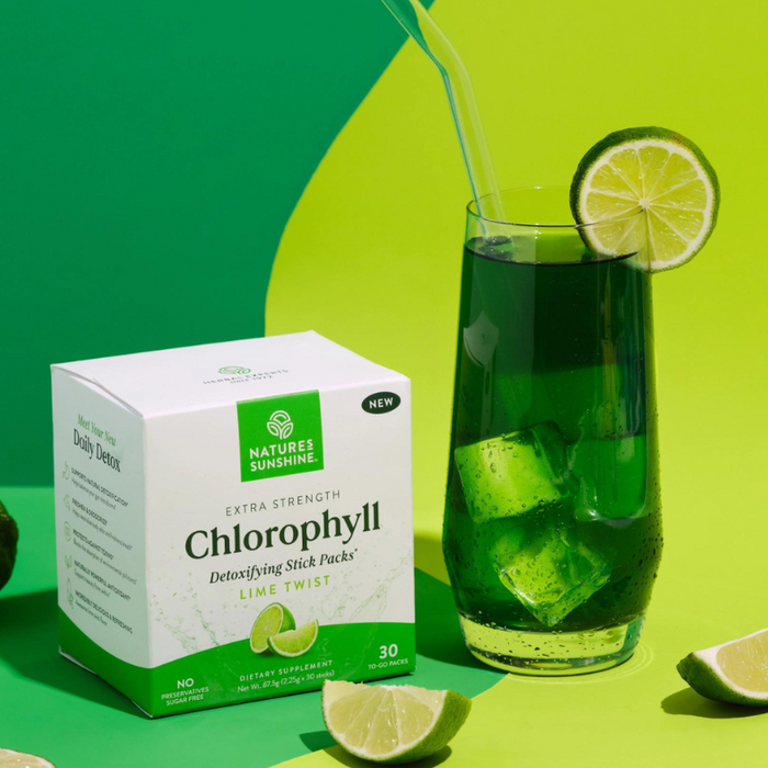 Natures Sunshine chlorophyll stick pack and glass of chlorophyll in water with limes