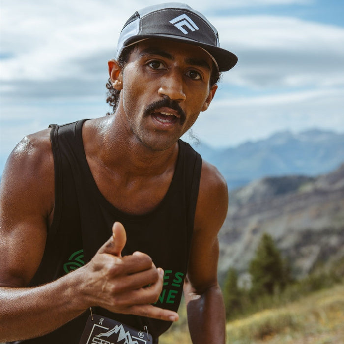 Healthy man running in race