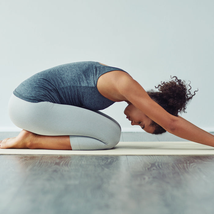 woman in downward dog yoga position