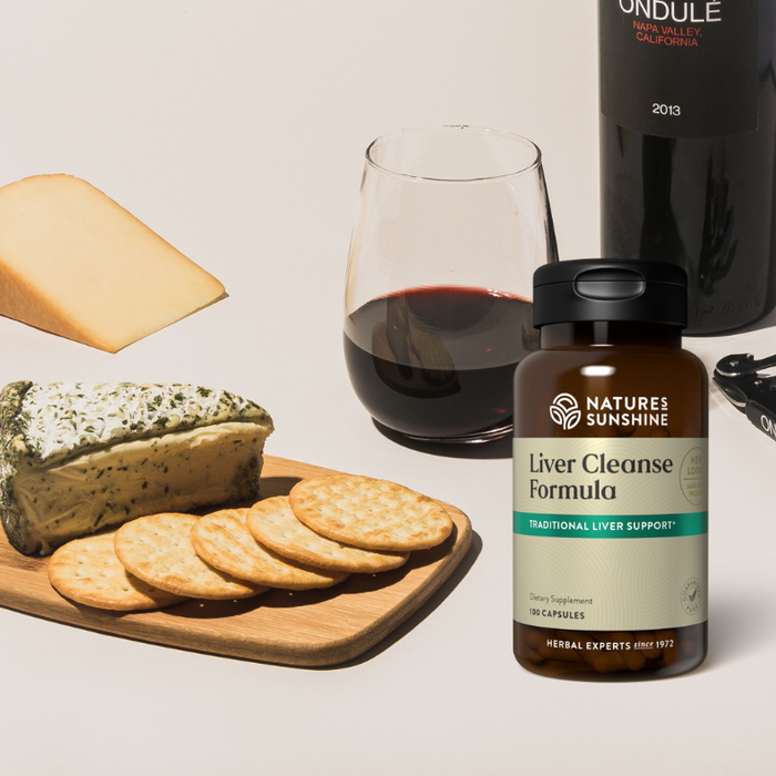 Natures Sunshine liver cleanse formula sitting next to wine and cheese
