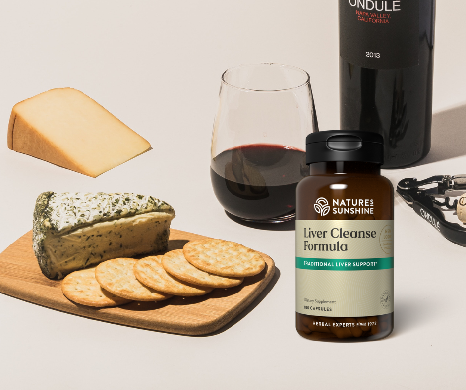 Natures Sunshine liver cleanse formula sitting next to wine and cheese