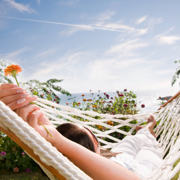 woman outside on sunny day in hammock